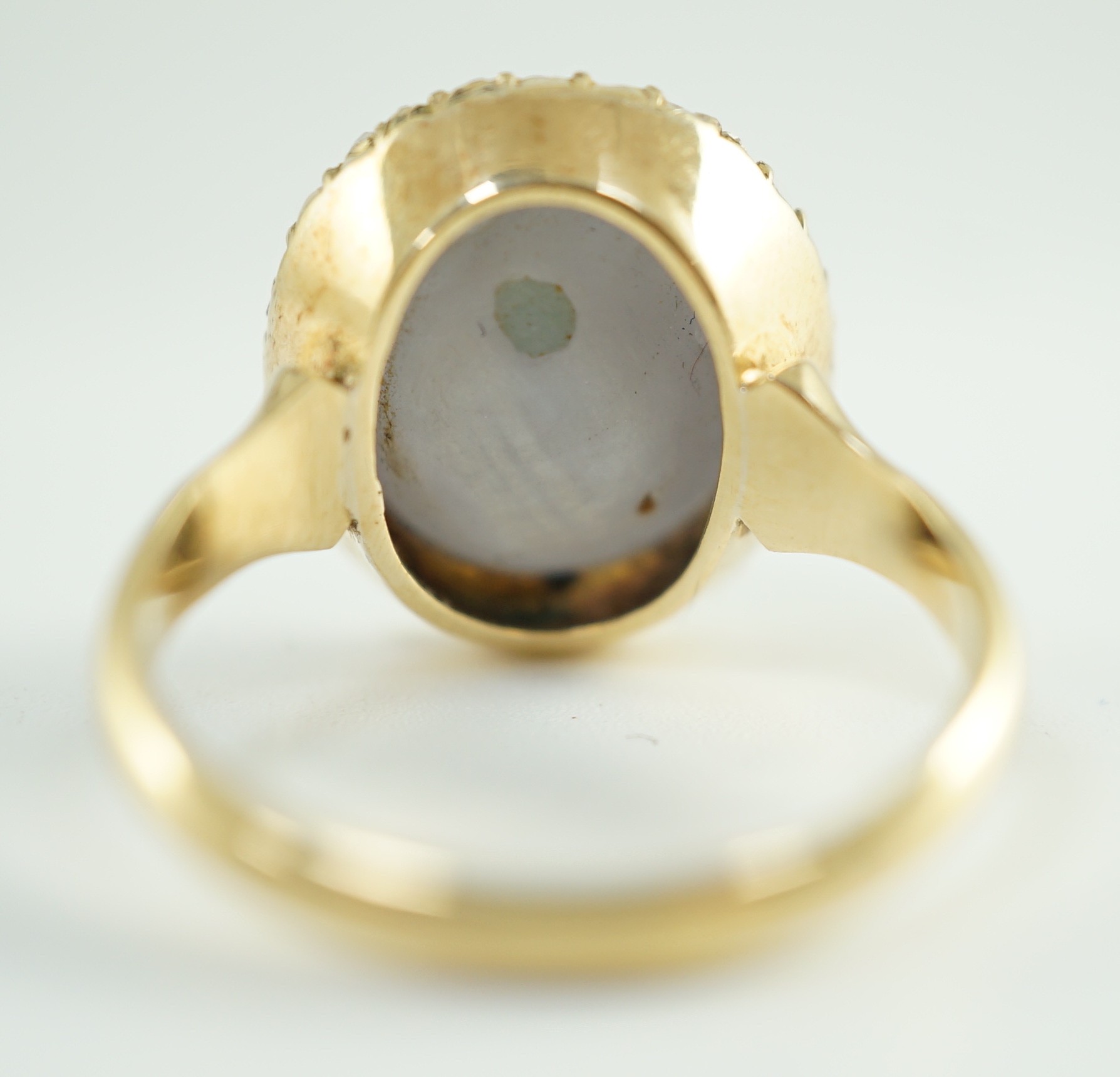 An early to mid 20th century 18ct gold, cabochon star sapphire and rose cut diamond set oval cluster ring